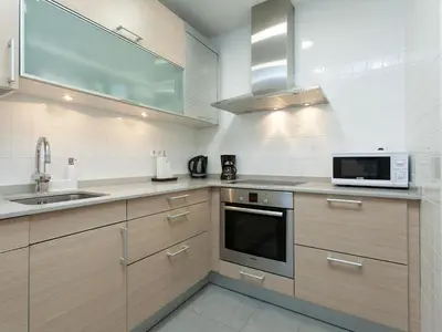 a kitchen with a sink and a microwave at RentBCN Rambla Catalunya Apartment in Barcelona