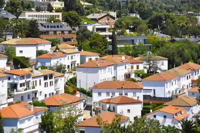 a city with white houses with orange roofs at Vacation house with garden in the foothills in Barcelona