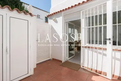 a villa with a view of the entrance to the house at Vacation house with garden in the foothills in Barcelona
