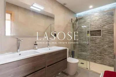 a bathroom with a toilet and a sink and a shower at Vacation house with garden in the foothills in Barcelona