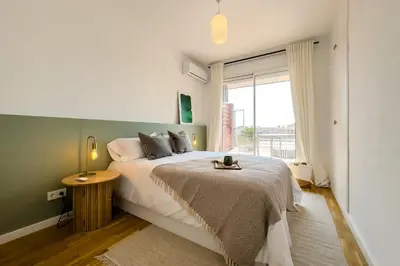 a bedroom with a large bed and a window at Sagrada in Barcelona