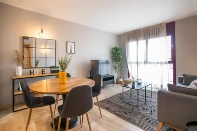 a living room with a table and chairs and a couch at 13MAL1077- Magnific 2BR flat in Barcelona