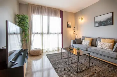 a living room with a couch and a table at 13MAL1077- Magnific 2BR flat in Barcelona