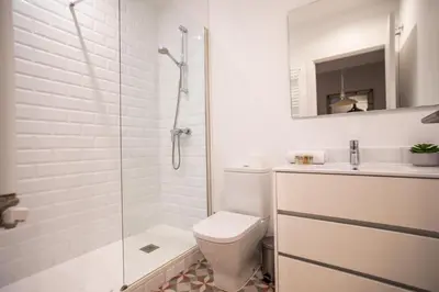 a bathroom with a shower and a toilet and a sink at B3MAL1081- New 2BR flat with private terrace in Barcelona