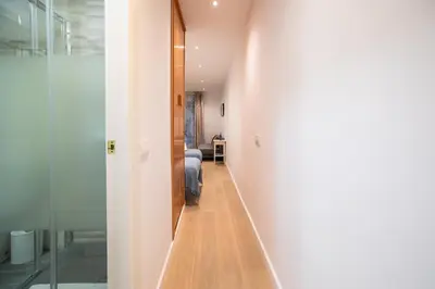 a hallway leading to a bedroom in a house at E4lle1031 - Studio next to Plaza Espanya in Barcelona