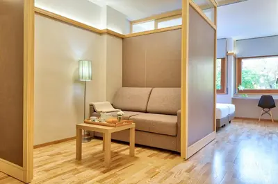 a living room with a couch and a table at Bonanova Suite in Barcelona