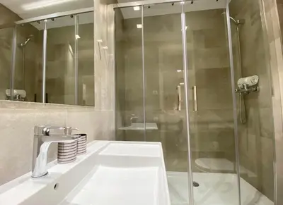 a bathroom with a sink and a shower at Spacious Elegant on Avenue Diagonal By MyRentalHost in Barcelona