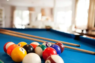 a group of billiard balls on a pool table at Villa Gaudi in San Justo Desvern