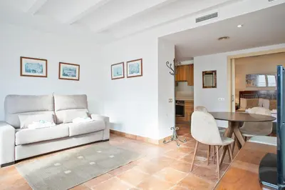 a living room with a couch and a table at Alcam Dali in Barcelona