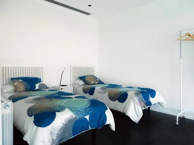 two beds sitting next to each other in a bedroom at Holiday Home Alexander Plana in Pallejá