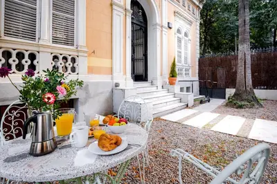 a table with a bowl of fruit on it at Canela Homes BARCELONA PERMANYER in Barcelona