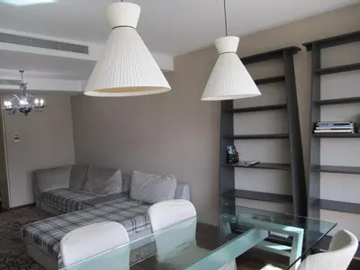 a living room with a couch and a glass table at Torre Forum in Sant Adria de Besos