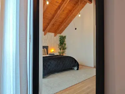 a bedroom with a black bed in a room at Venecia relax in Vallirana