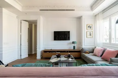 a living room with a couch and a tv at Rental Apartment Barcelona in Barcelona