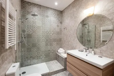 a bathroom with a sink and a shower and a mirror at Rental Apartment Barcelona in Barcelona