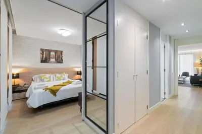 a bedroom with a bed and a large mirror at Tendency Rambla Catalunya in Barcelona