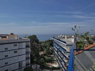 a view of the ocean from a building at BCN | Duplex Penthouse & Pool in Sant Andreu de Llavaneres