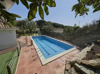a swimming pool in the yard of a house at Villa Julia | 14pax. 5' sea & train in Sant Andreu de Llavaneres