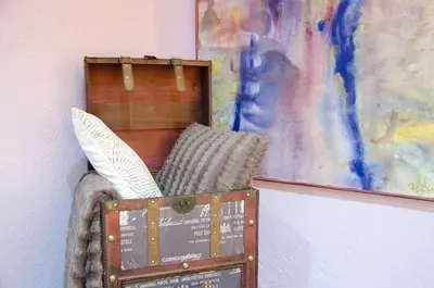 a wooden box with a pillow next to a painting at Vacarisses- Torreblanca Estacin in Vacarisas