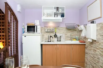 a small kitchen with a sink and a refrigerator at Vacarisses- Torreblanca Estacin in Vacarisas