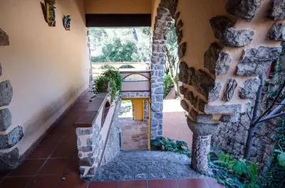 a stone stairway in a house with a stone wall at Vacarisses- Torreblanca Estacin in Vacarisas