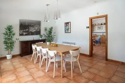 a dining room with a table and chairs at Elis house Piscina Privada Villa Mediterránea in Castelldefels