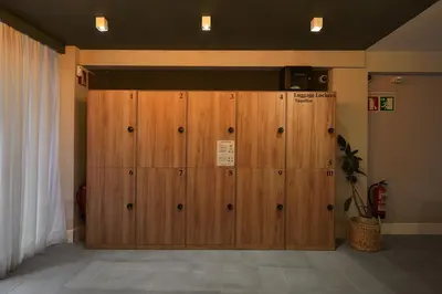 a large wooden door in a room at Numa Barcelona Brio in Barcelona