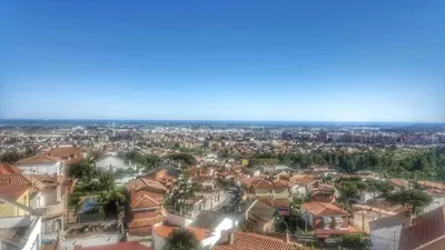 an aerial view of a city with houses at Apartamento con vistas al mar in Viladecáns