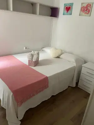 a bedroom with two beds with white sheets at Alojamiento muy cómodo in Hospitalet de Llobregat