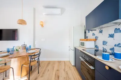 a kitchen with a table and a counter top at The Nest Masia Can Tiranasi Relájate y Disfruta Escapada con Encanto Cerca de Barcelona- in Badalona