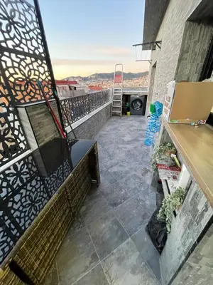 a balcony with a bench and a view at Piso luxori in Santa Coloma de Gramanet