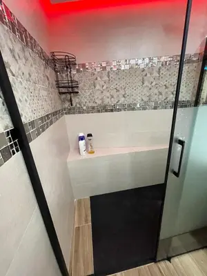 a bathroom with a sink and a shower stall at A comfortable apartment in Santa Coloma de Gramanet