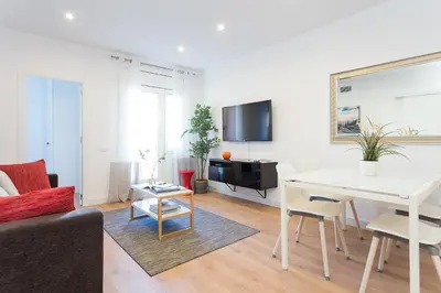 a living room with a couch and a table at Opening Doors Sagrada Familia II in Barcelona
