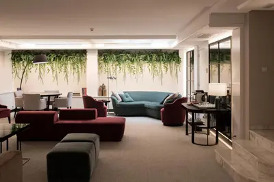 a balcony with chairs and an umbrella on a ship at Acacia Suite in Barcelona