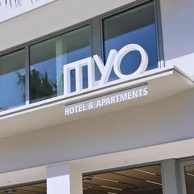 a sign on top of a hotel and apartments at MYO Barcelona Hotel & Apartments in Castelldefels