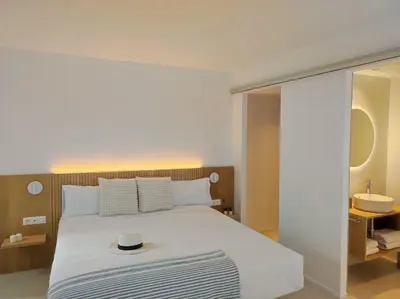 a bedroom with a bed and a sink at MYO Barcelona Hotel & Apartments in Castelldefels