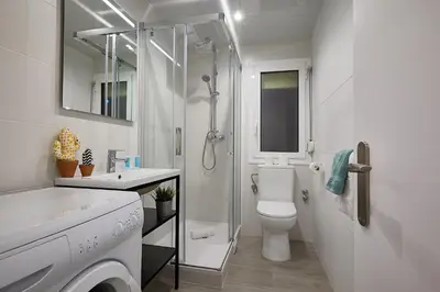 a bathroom with a shower and a toilet and a sink at BBarcelona Gracia Apartment in Barcelona
