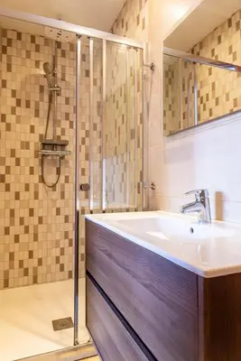 a bathroom with a sink and a shower at Sagrada Familia views, big and bright apartment in Barcelona