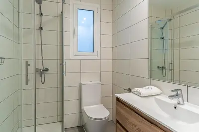 a bathroom with a toilet and a sink and a shower at 4305 - AB Eixample Sepúlveda 157 in Barcelona