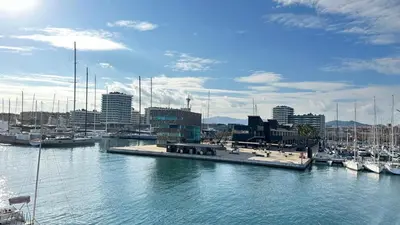 a group of boats docked in a harbor with a city at Apartment close Barcelona - Rentals Badalona Beach - Free Parking in Badalona