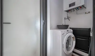 a washer and dryer in a small room at Central One bedroom apartment You Stylish Apartments in Barcelona