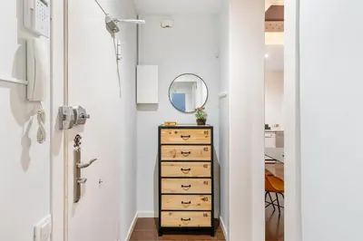 a hallway with a dresser and a mirror at Muntaner in Barcelona