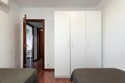a kitchen with a stainless steel stove and refrigerator at Camp nou Apartamento in Hospitalet de Llobregat