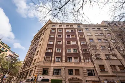 a tall brick building on a city street at Sweett - Vicky Barcelona in Barcelona