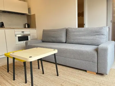 a living room with a couch and a coffee table at Beautiful renovated studio in Castelldefels