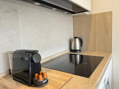 a kitchen with a coffee maker on a counter at Beautiful renovated studio in Castelldefels