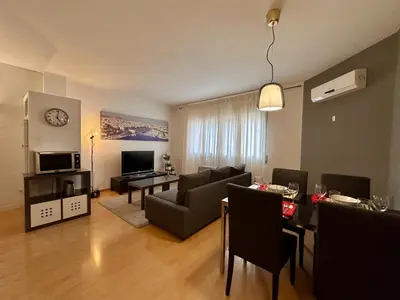 a living room with a couch and a table at Spacious home in Bonanova in Barcelona