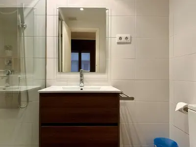 a bathroom with a sink and a mirror at Spacious home in Bonanova in Barcelona