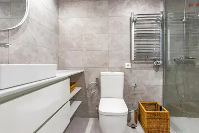 a bathroom with a toilet and a shower at AIGUADOLÇ APARTMENT in Sitges