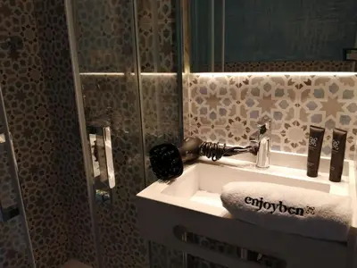 a bathroom with a sink and a mirror at Beachfront apartment Barceloneta Street in Barcelona